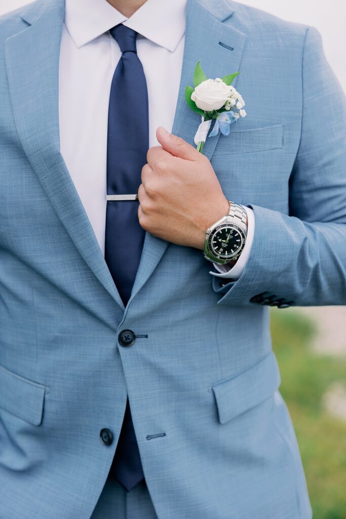 Groom getting ready at the Inn at Bay Harbor